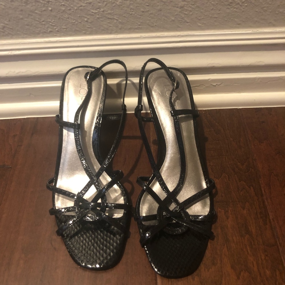 Black patten leather kitten heels.